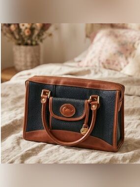 Dooney & Bourke Black Pebbled Leather Satchel with Brown Trim
